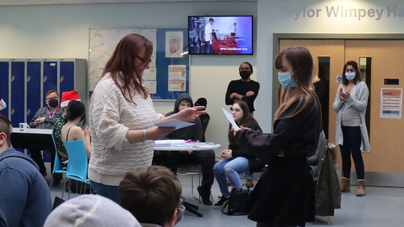 Female student receiving award