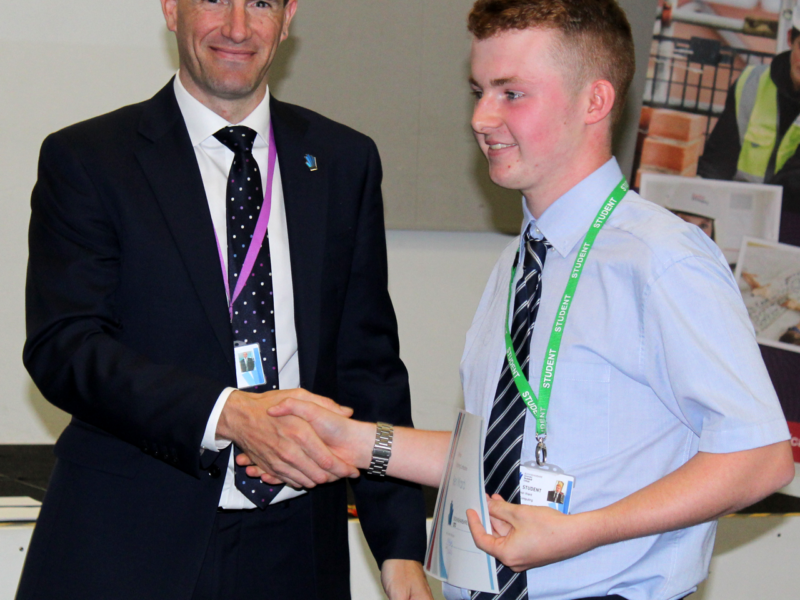 Principal congratulates an Able and qualified Student Ben Ward